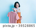 Asian girl designer is showing off the shirt  39328865