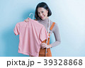 Asian girl designer is showing off the shirt 39328868