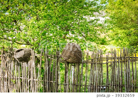Spring Fence from woven rods and branches  39332659