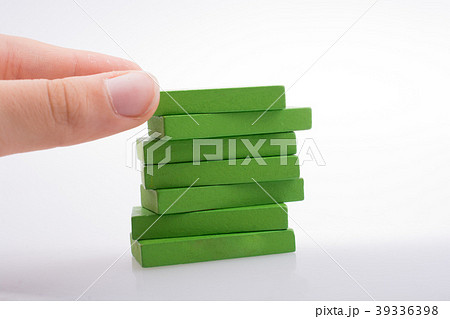 Hand holding color dominoes 39336398