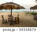 Side of chairs set with umbrella on the beach back 39338674