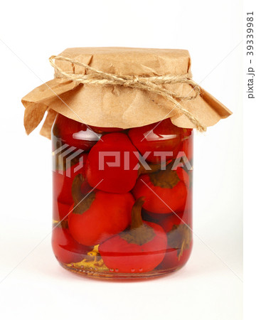 Jar of pickled red hot chili peppers over white 39339981