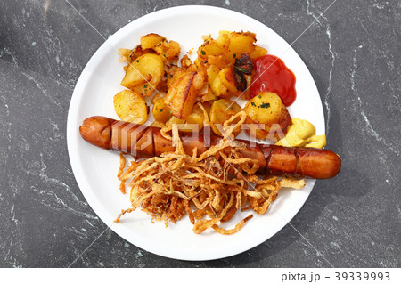 Close up portion of sausage with roasted potato 39339993