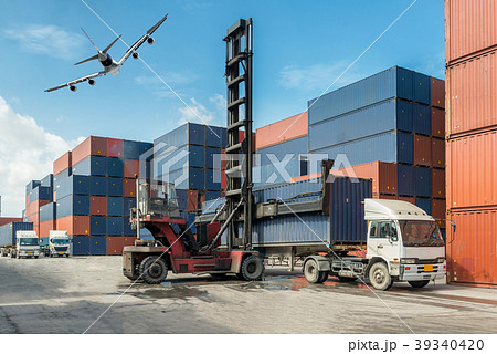 Forklift handling container box loading at docks Forklift handling container box loading at docks 39340420
