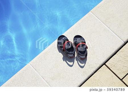 Baby sandals at the swimming pool Baby sandals at the swimming pool 39340789