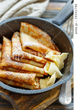 Crepes with butter for breakfast. Crepes with butter for breakfast. 39342786