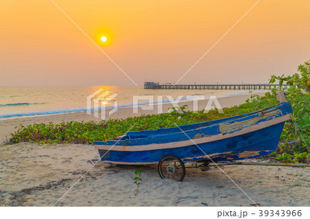 Sunset at anchor fishing boat at low tide 39343966