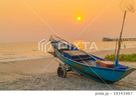 Sunset at anchor fishing boat at low tide 39343967