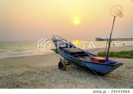 Sunset at anchor fishing boat at low tide 39343968