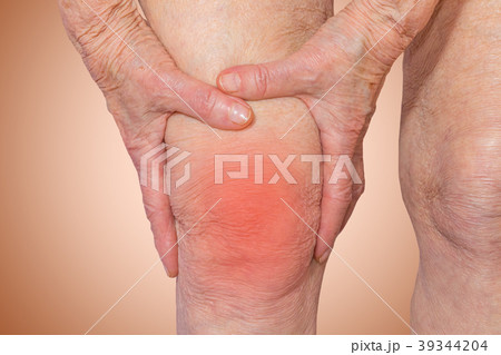Senior woman holding the knee with pain Senior woman holding the knee with pain 39344204
