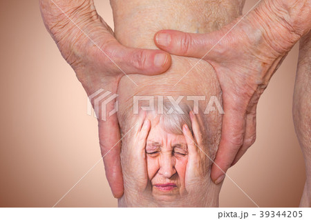 Senior woman holding the knee with pain. Senior woman holding the knee with pain. 39344205