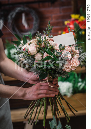 Florist making beautiful bouquet Florist making beautiful bouquet 39344770