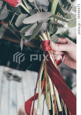 Young florist woman making beauty bouquet Young florist woman making beauty bouquet 39346471