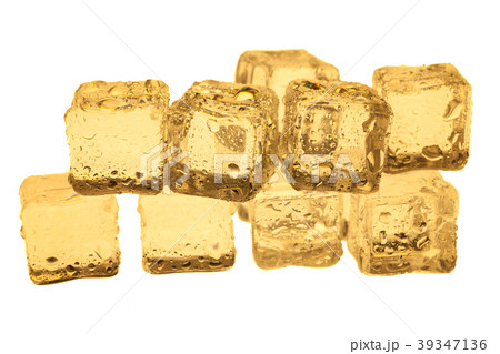 Golden ice cubes on white background. 39347136
