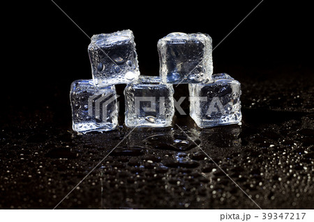 ice cubes on black background. ice cubes on black background. 39347217