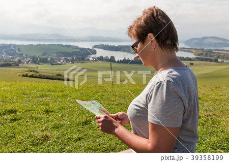 Woman with map on summer hills in Slovakia Woman with map on summer hills in Slovakia 39358199