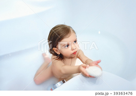 Girl with soap in bath 39363476