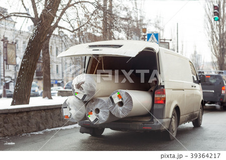 Carpet delivery van with open trunk. Large bulky Carpet delivery van with open trunk. Large bulky 39364217