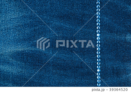 Line of blue rhinestones inlaid on a denim fabric. Line of blue rhinestones inlaid on a denim fabric. 39364520