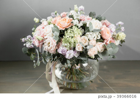 beautiful bouquet of flowers set on wooden table 39366016