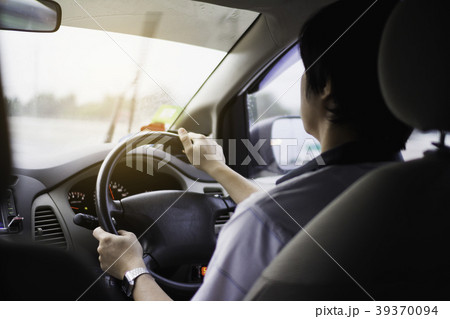 man driving car from rear view on the highway. man driving car from rear view on the highway. 39370094