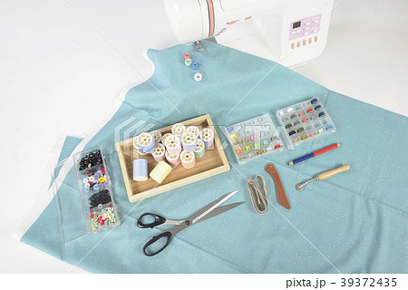 Sewing machine and colorful thread rolls. Sewing machine and colorful thread rolls. 39372435