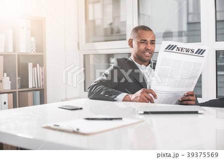 Young handsome man resting with journal 39375569
