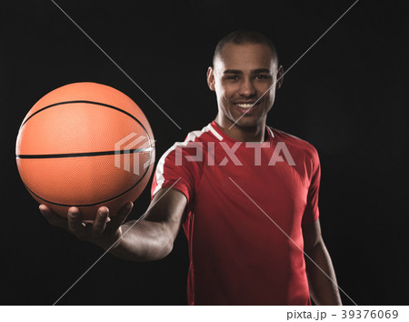 Fun african guy demonstrating ball 39376069