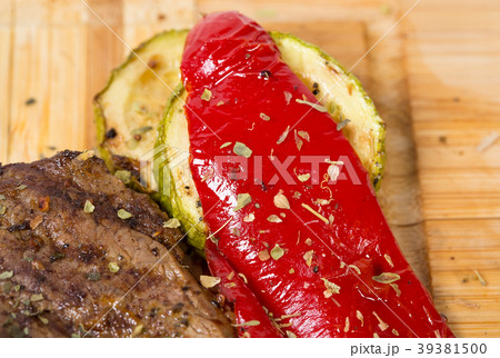 Mixed grilled meats platter closeup. 39381500
