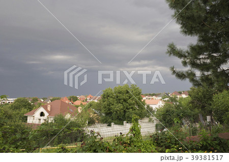 Urban landscape and dark trees. Urban landscape and dark trees. 39381517