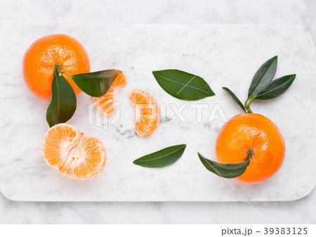 Glass  bottle of fresh mandarin tangerines juice 39383125