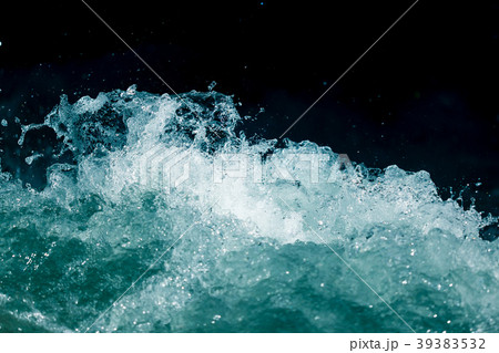 Splash of stormy water in the ocean on a black 39383532
