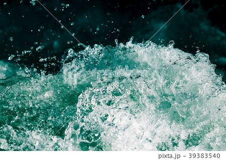 Splash of stormy water in the ocean on a black Splash of stormy water in the ocean on a black 39383540
