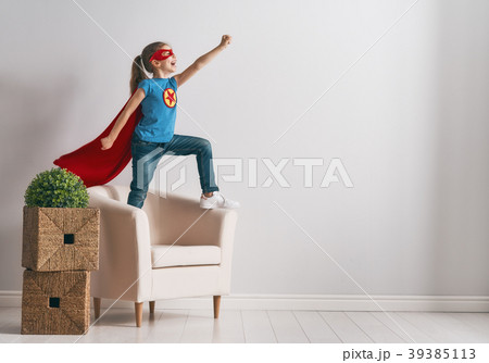 child is playing superhero 39385113