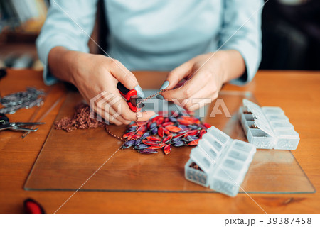 Female hands with pliers, bijouterie making 39387458