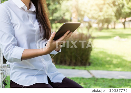 Work and relax, Woman freelancer is working on digital tablet, w 39387773