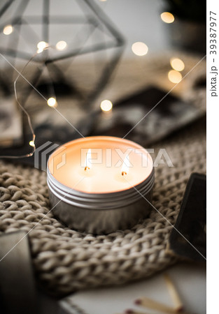 Cozy warm home decoration with burning candle and 39387977
