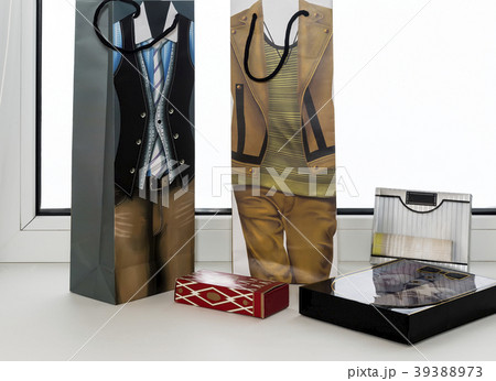 Two gift bags and a variety of gifts. 39388973