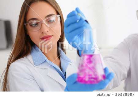 Technician hold in arms in protective gloves 39388987