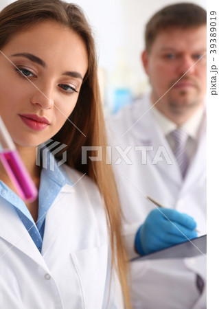 Technician hold in arms in protective gloves Technician hold in arms in protective gloves 39389019