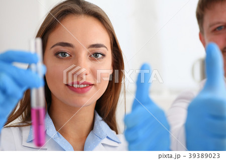 Technician hold in arms in protective gloves 39389023