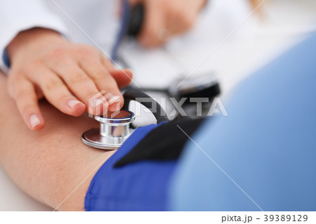 Female doctor arms make medic procedure closeup Female doctor arms make medic procedure closeup 39389129