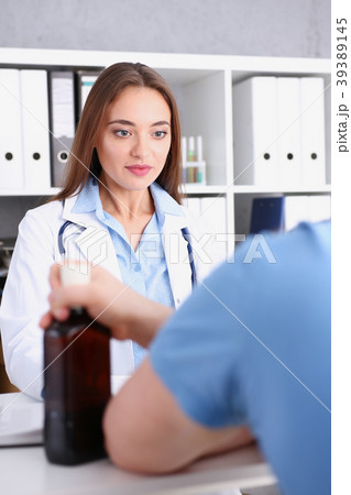 Beautiful female doctor and sleepy alcoholic Beautiful female doctor and sleepy alcoholic 39389145
