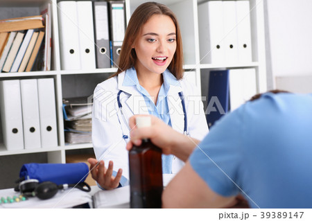 Beautiful female doctor and sleepy alcoholic Beautiful female doctor and sleepy alcoholic 39389147