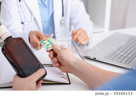 Alcoholic hold in arm empty bottle and medication Alcoholic hold in arm empty bottle and medication 39389153