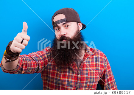 Happy long bearded man showing a thumbs up Happy long bearded man showing a thumbs up 39389517