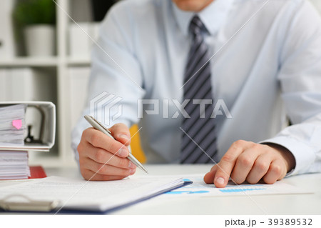 Male hand holding silver pen ready to 39389532