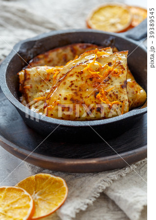 Crepe suzette with orange sauce. 39389545