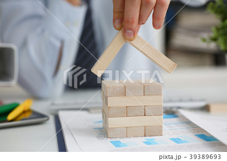 Male hand holds the roof to the lock in Male hand holds the roof to the lock in 39389693