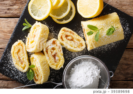 Traditional lemon roll with fruit curd, with mint Traditional lemon roll with fruit curd, with mint 39389698